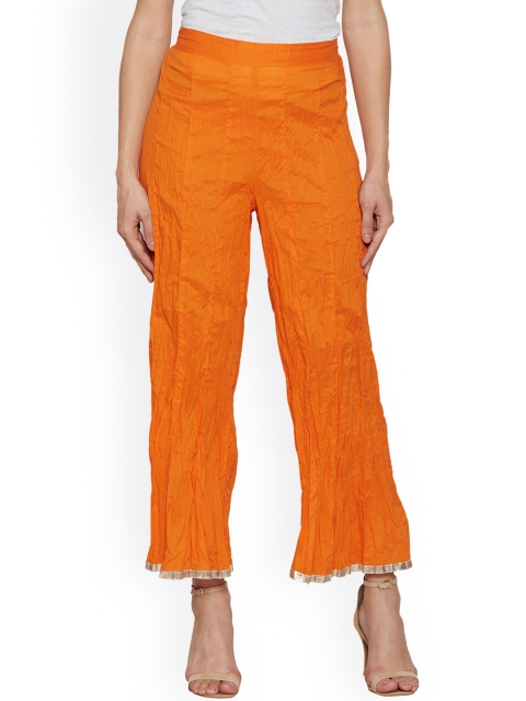 

Globus Women Orange Flared Self Design Palazzos