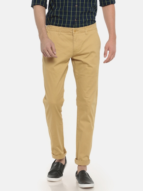 

Ruggers Men Beige Solid Tapered Fit Regular Trousers