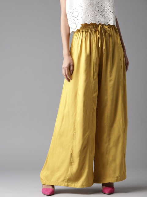 

Moda Rapido Women Mustard Yellow Solid Flared Palazzos