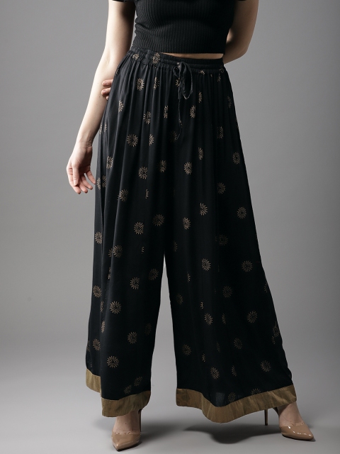 

Moda Rapido Women Black & Golden Printed Flared Palazzos