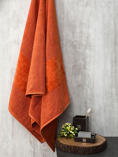 

Pure Home and Living Orange Solid Cotton 555 GSM Bath Towel