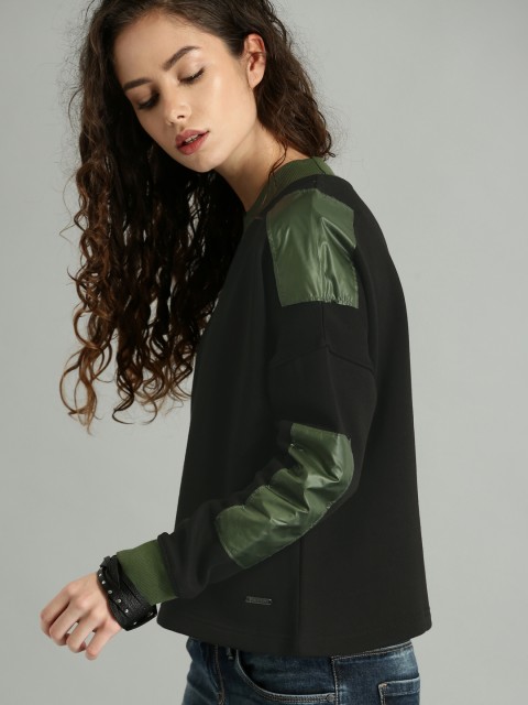 

Roadster Women Black Solid Sweatshirt