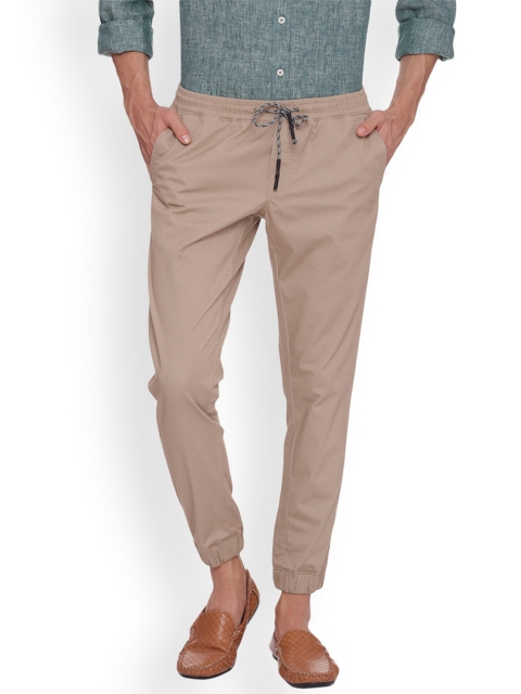 

Basics Men Beige Tapered Fit Solid Joggers