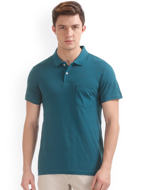 

Arrow Men Teal Solid Polo Collar T-shirt