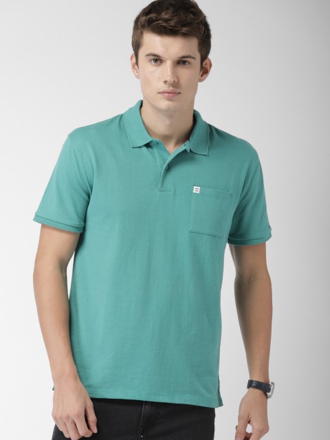 

Tommy Hilfiger Men Teal Gren Solid Polo Collar T-shirt