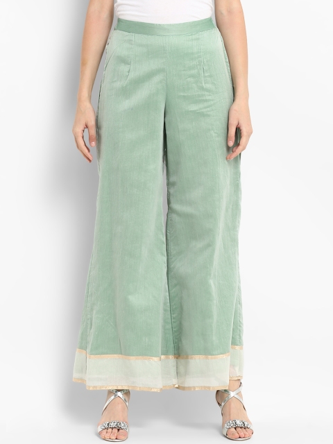 

Abhishti Women Sea Green & White Solid Flared Palazzos