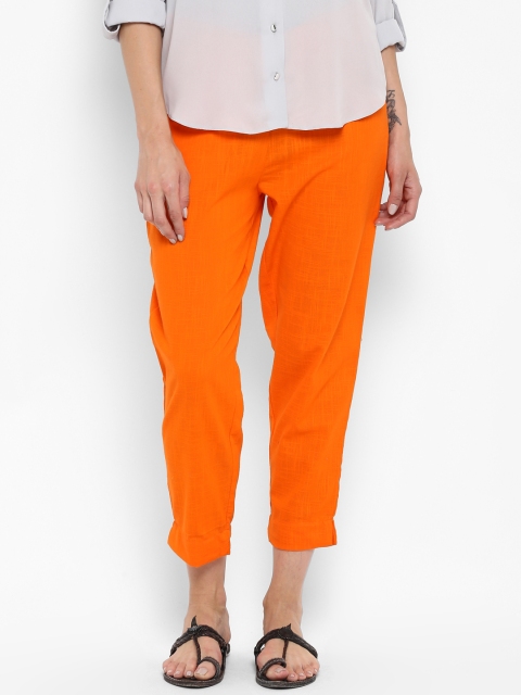 

Sringam Women Orange Solid Cropped Trousers