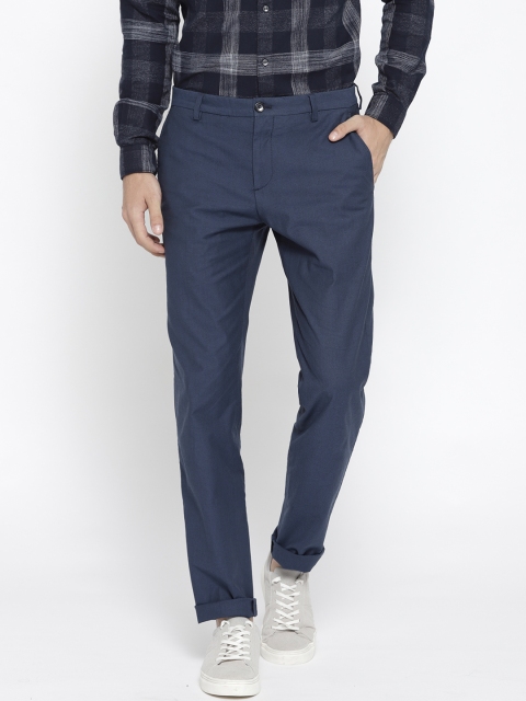 

Tommy Hilfiger Men Blue Regular Fit Solid Trousers