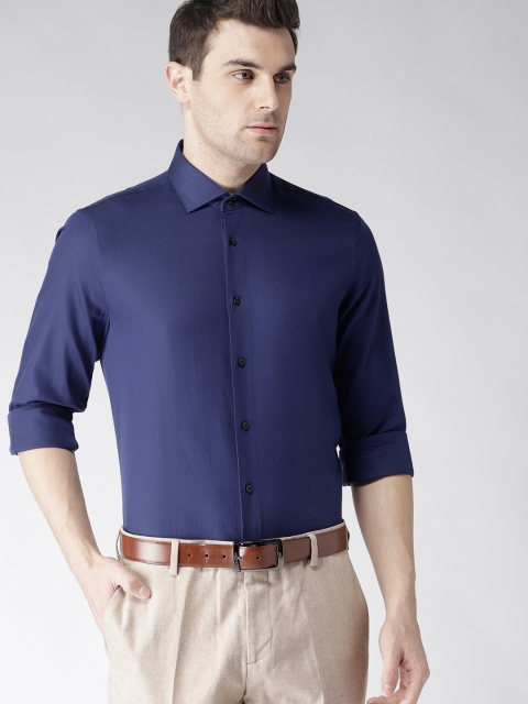 

Tommy Hilfiger Men Navy Blue Slim Fit Solid Smart Casual Shirt