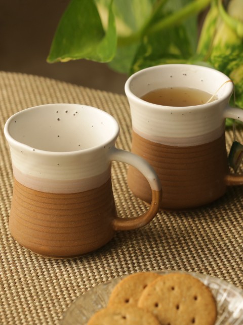 

ExclusiveLane White & Brown 2-Pieces Vanilla Rims Solid Ceramic Studio Pottery Tea & Coffee Mugs