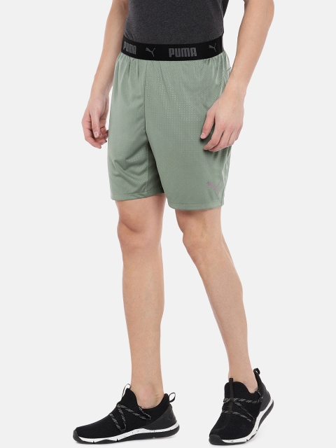 

Puma Men Olive Green Solid FTBLNXT Graphic Print Shorts