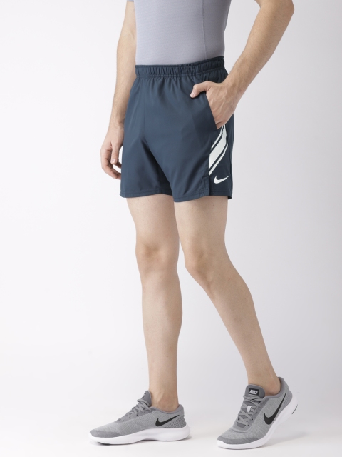 

Nike Men Navy Blue Solid Standard Fit DRY SHORT 7IN Tennis Shorts