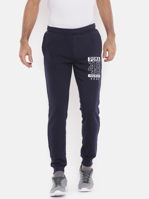 

Puma Men Navy Graphic TR cl VIII Joggers, Navy blue