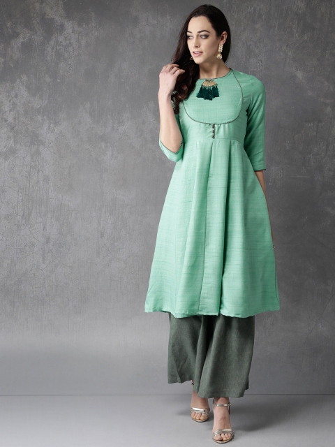 

Anouk Women Green Solid Kurta with Palazzos