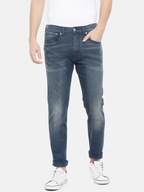 

Calvin Klein Jeans Men Blue Tapered Fit Mid-Rise Clean Look Stretchable Jeans