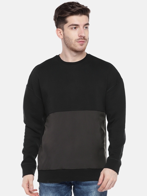 

Reebok Men Black Solid Sweatshirt
