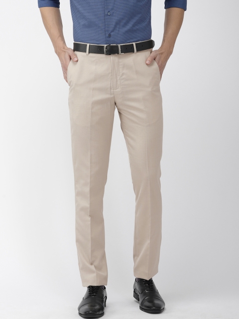 

Arrow New York Men Beige Tapered Fit Solid Formal Trousers