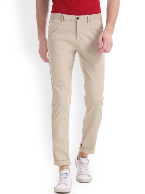 

Arrow Sport Men Beige Slim Fit Solid Regular Trousers