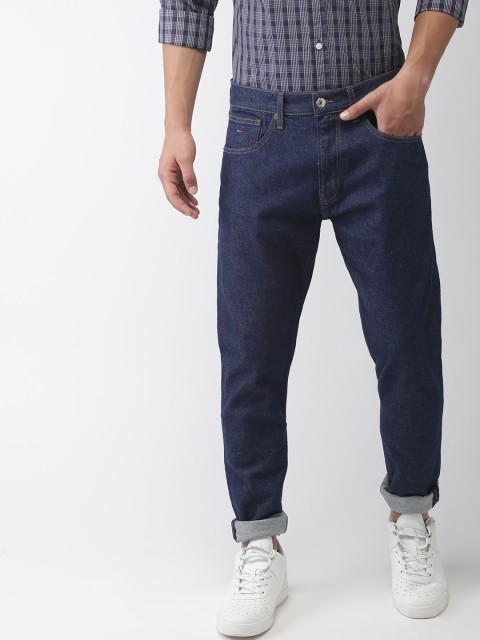 

Tommy Hilfiger Men Blue Tapered Fit Mid-Rise Clean Look Stretchable Jeans