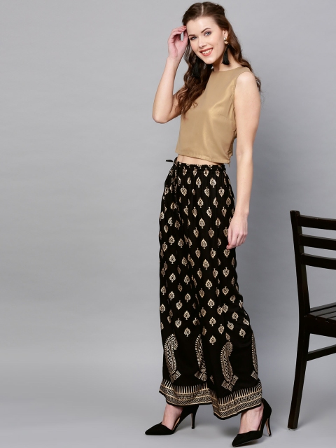 

Ishin Women Black & Golden Printed Flared Palazzos