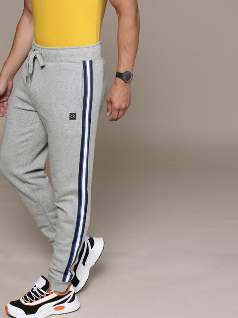 

Calvin Klein Jeans Men Grey Solid Slim Fit Joggers With Side Stripe Detail
