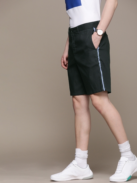

Calvin Klein Jeans Men Black Solid Slim Fit Regular Shorts