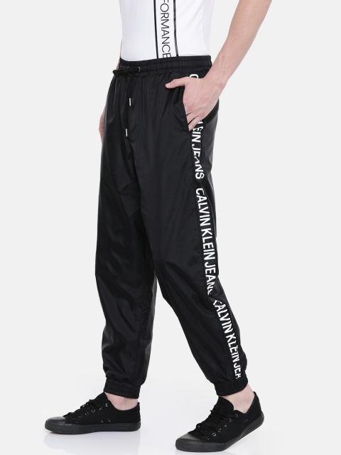 

Calvin Klein Jeans Men Solid Printed Joggers, Black