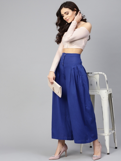 

Tulsattva Women Blue Solid Flared Palazzos