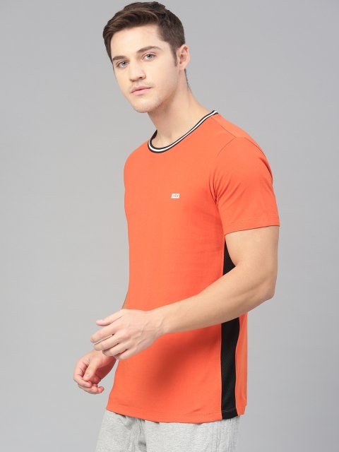 

HRX by Hrithik Roshan Men Orange Solid Lifestyle Round Neck Tshirt