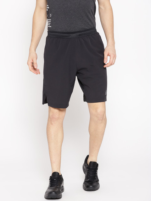 

Reebok Men Black Solid OST Knit Woven Training Shorts