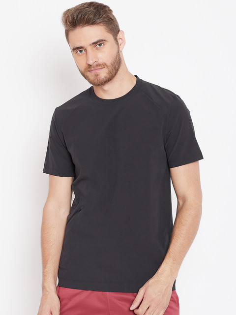 

Reebok Men Black TS Woven T-shirt