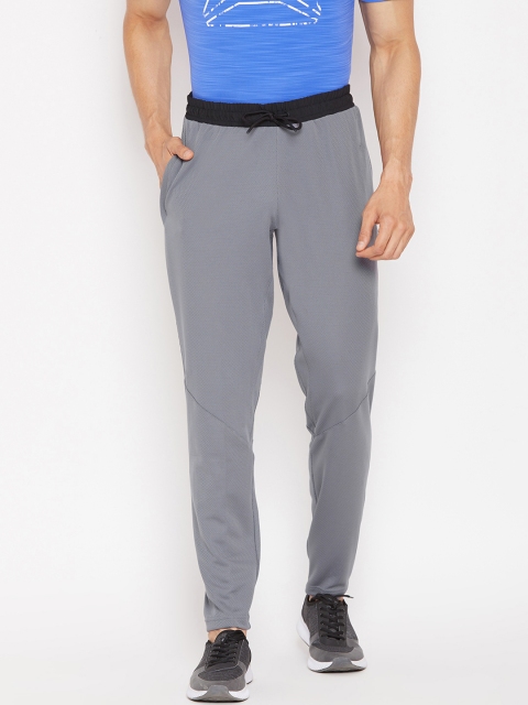 

Reebok Men Grey Solid WOR Trackster Track Pants