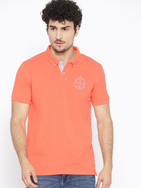 

Peter England Casuals Men Coral Orange Solid Polo Collar T-shirt