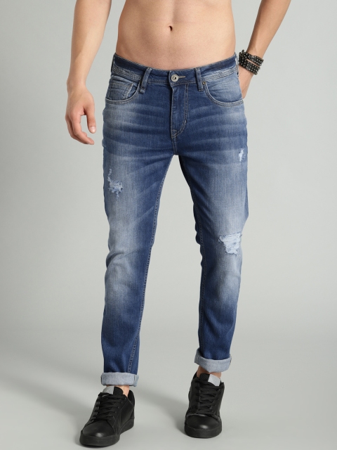 

The Roadster Lifestyle Co Men Blue Premium Mildly Distressed Skinny Fit Mid-Rise Stretchable Jeans