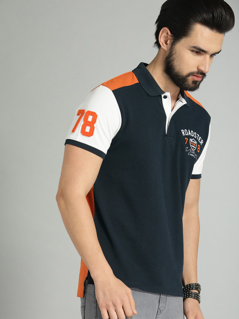 

Roadster Men Navy Blue & Orange Colourblocked Polo T-shirt