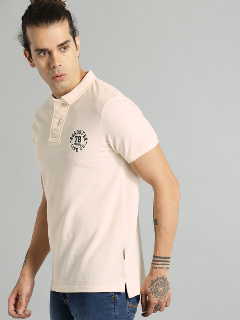 

Roadster Men Peach-Coloured Solid Polo Collar T-shirt