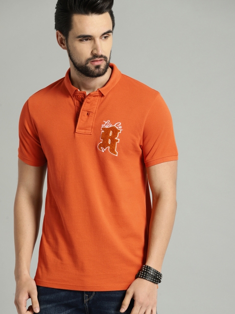 

The Roadster Lifestyle Co Men Orange Solid Polo Pure Cotton T-shirt