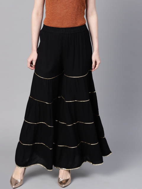 

Ishin Women Black Solid Flared Palazzos