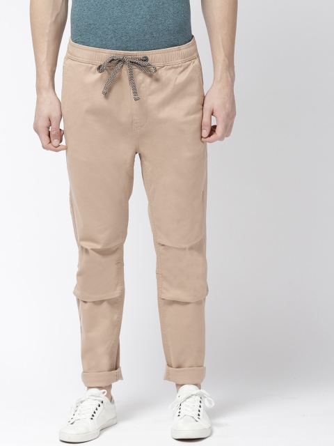 

Superdry Men Beige Tapered Fit Solid Regular Trousers