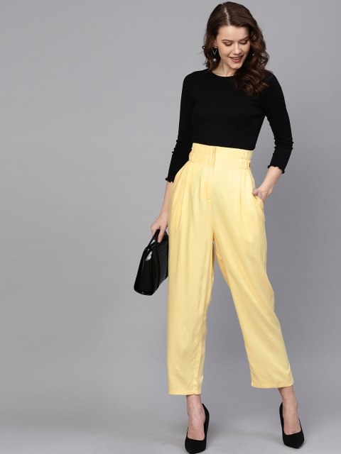 

Femella Women Yellow Relaxed Solid Regular Trousers