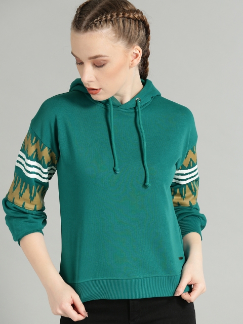 

Roadster Women Teal Green Solid Hooded Sweatshirt