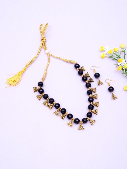 

Golden Peacock Black Beads Jeweller Set