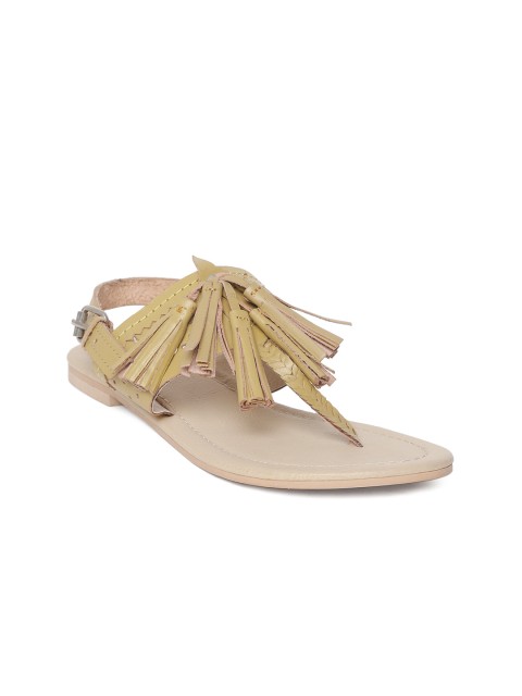 

Crave Connect Women Mustard Yellow Tasselled Leather T-Strap Flats With Cut-Work Detail
