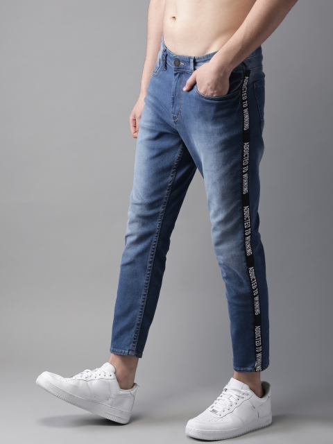 

Moda Rapido Men Blue Ankle Slim Tapered Fit Mid-Rise Clean Look Stretchable Jeans