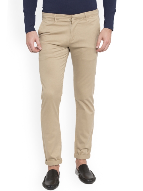 

SPYKAR Men Beige Slim Fit Solid Regular Trousers