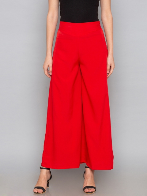 

Desi Weavess Women Red Flared Solid Palazzos