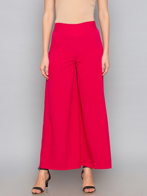 

Desi Weavess Women Pink Flared Solid Palazzos