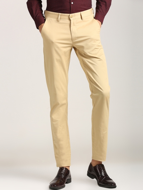 

Peter England Men Beige Slim Fit Solid Regular Trousers