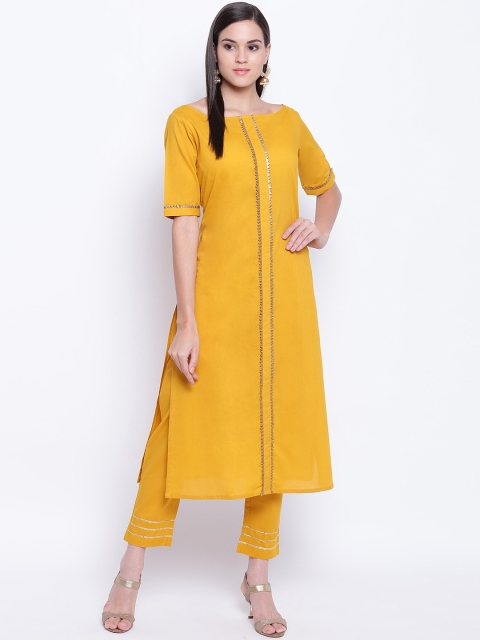 

FABNEST Women Yellow Solid Kurta with Trousers