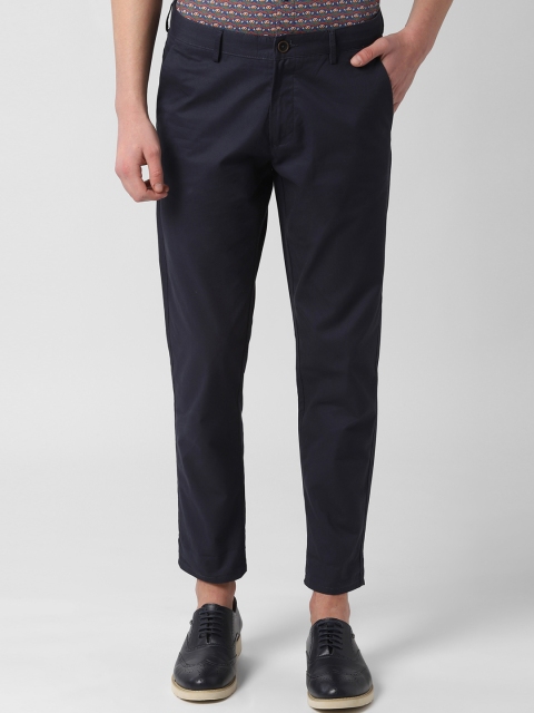 

Peter England Casuals Men Navy Blue Tapered Fit Solid Crop Regular Trousers